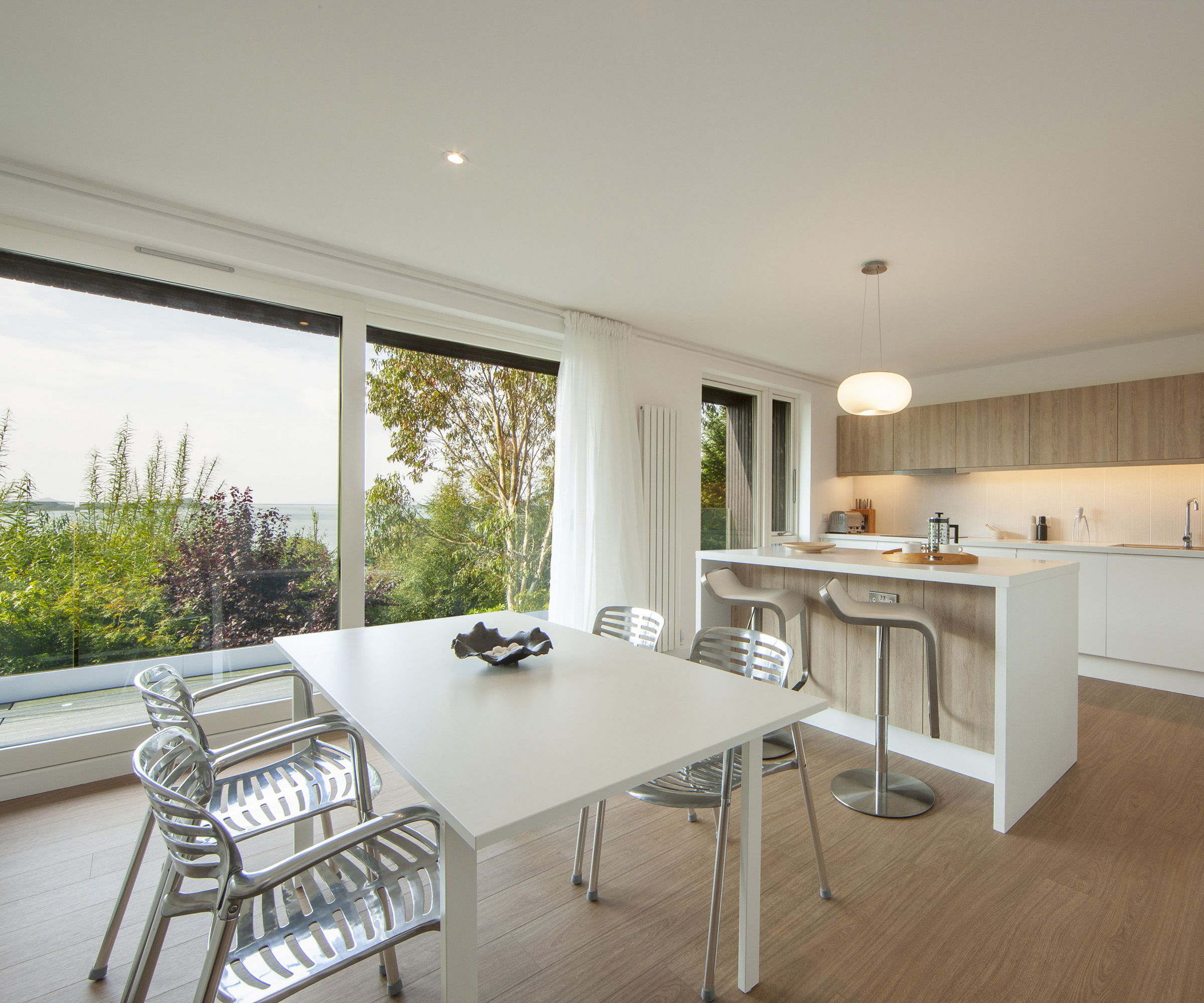 Interior of a self build home kitchen and dining area with views