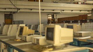 A retro photo of a room of abandoned computers