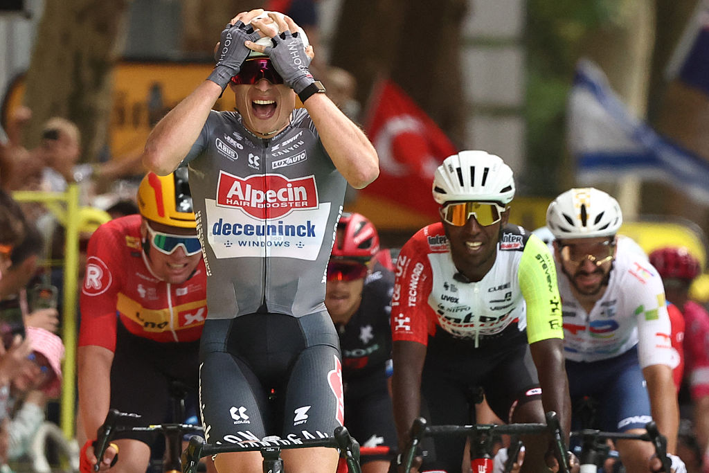 Alpecin - Deceuninck team&#039;s Belgian rider Jasper Philipsen (C) cycles to the finish line to win the 1st stage ahead of Intermarch - Wanty team&#039;s Eritrean rider Biniam Girmay (2nd R) and Uno-X Mobility team&#039;s Norwegian rider Soren Waerenskjold (L) the 112th edition of the Tour de France cycling race, 184.9 km starting and finishing in Lille Metropole, northern France, on July 5, 2025. (Photo by Anne-Christine POUJOULAT / AFP)