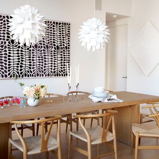 dining room with dining table and white wall