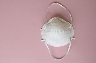 Face coverings exemptions: Face Mask On Pink Background