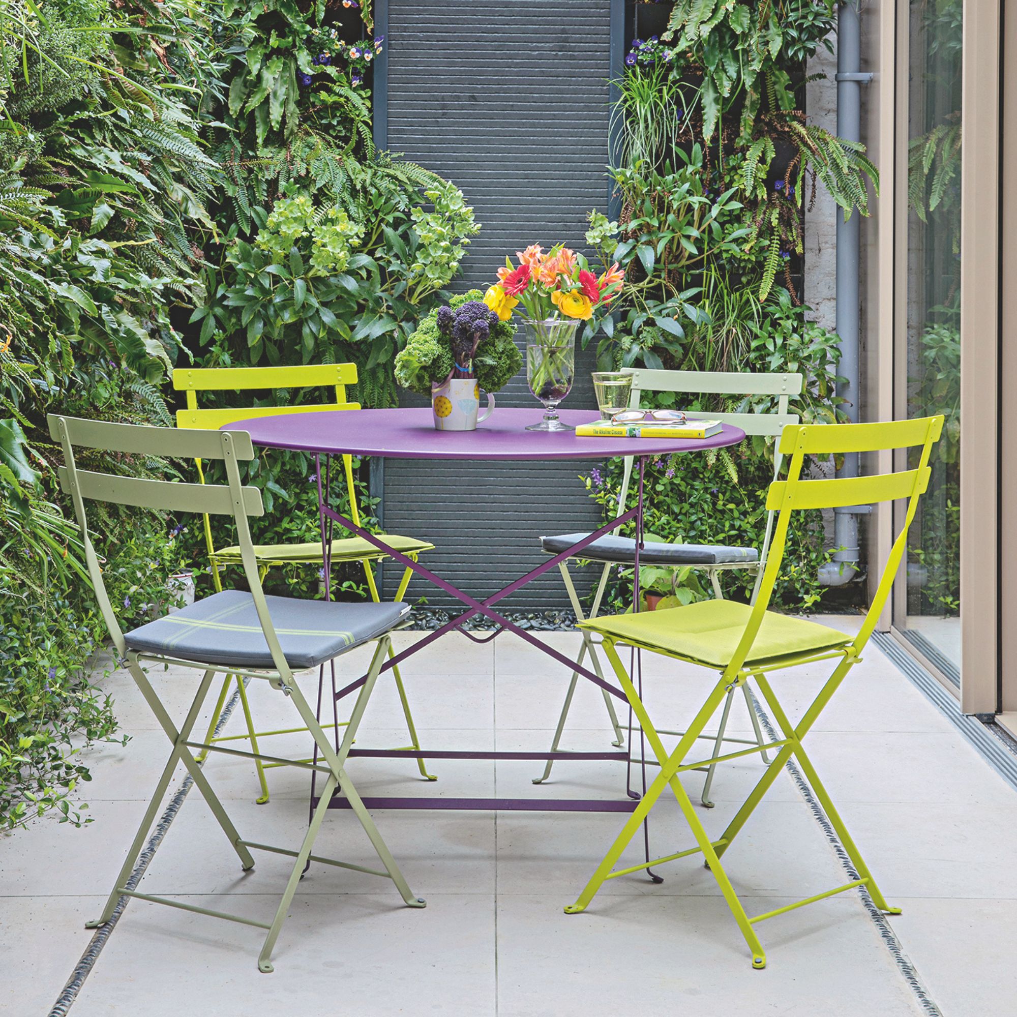 Outdoor courtyard with metal bistro table on it