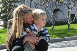 NASA astronaut Karen Nyberg shares a quiet moment with her 3-year-old son Jack during a tour of the Kremlin and Red Square in Moscow, Russia, on May 8, 2013.