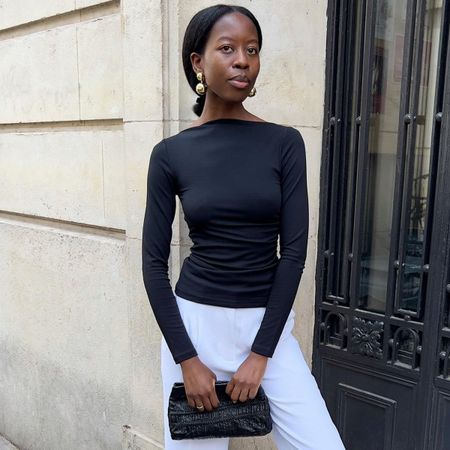 Women in black boat neck top