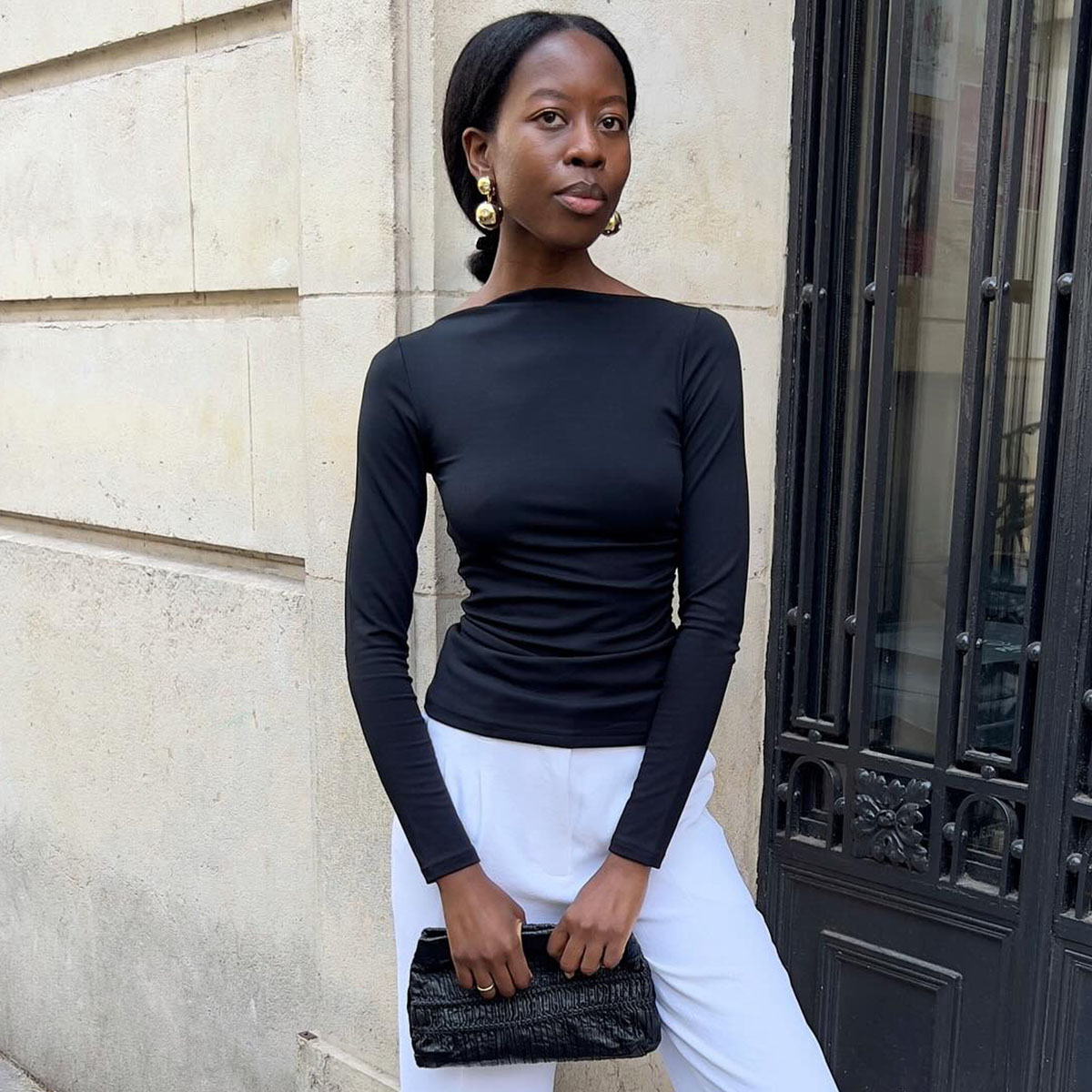 Women in black boat neck top
