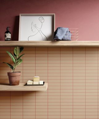 sand coloured tiles with pink grout and pink wall above