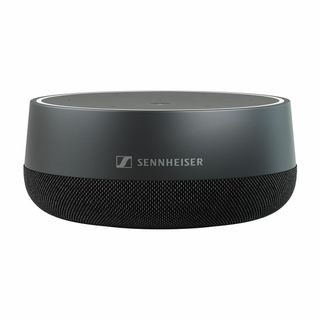 The Sennheiser TC speakerphone on a conference room cabinet.