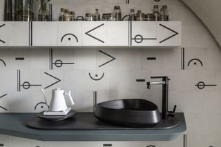 A kitchen with backsplash tiles customized as music notes