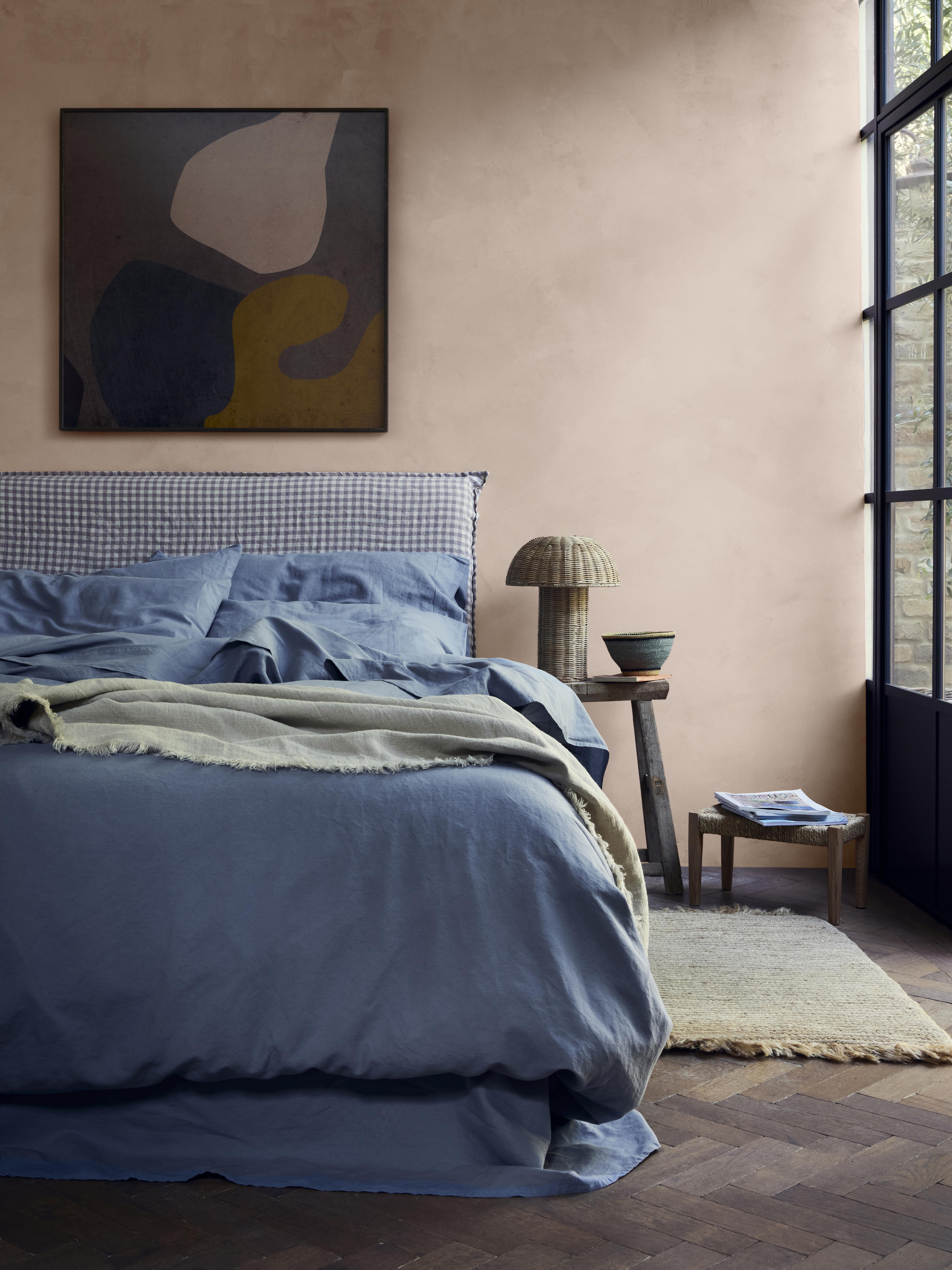 blue bed linen set in rustic bedroom