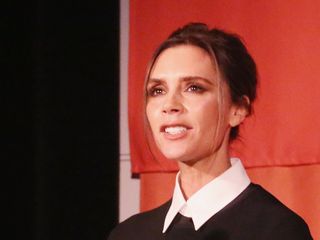 Victoria Beckham makes a speech in front of a crowd