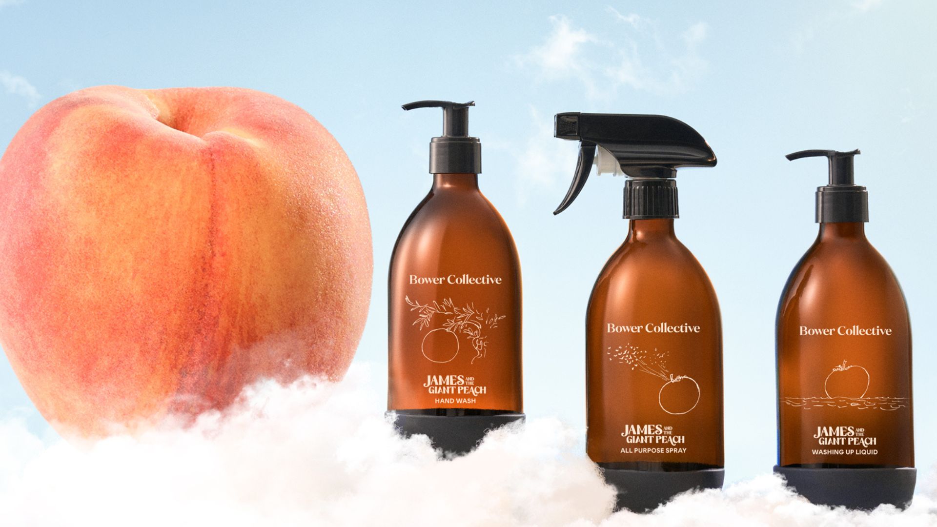 Bower Collective James And The Giant Peach Collection, showing the cleaning spray, hand washing and cleaning liquid on a cloud, next to a peach