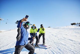 Three men skiing