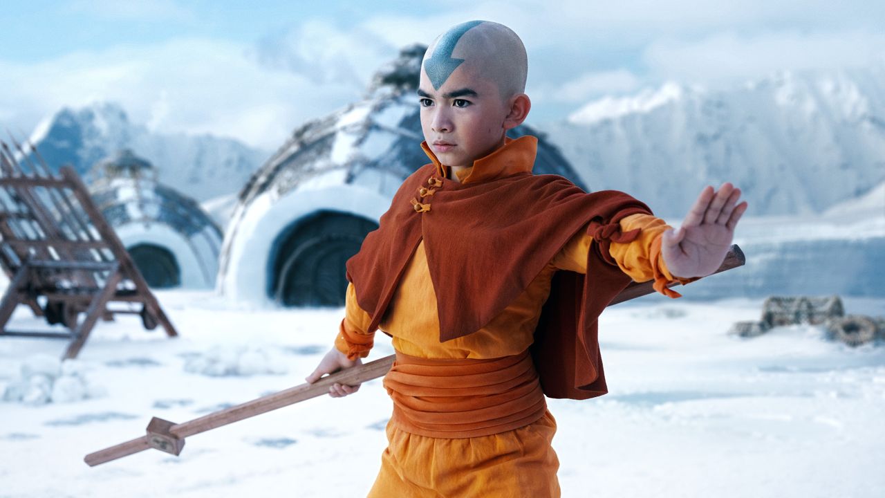 Aang (Gordon Cormier) poses with a staff in Netflix's Avatar: The Last Airbender series