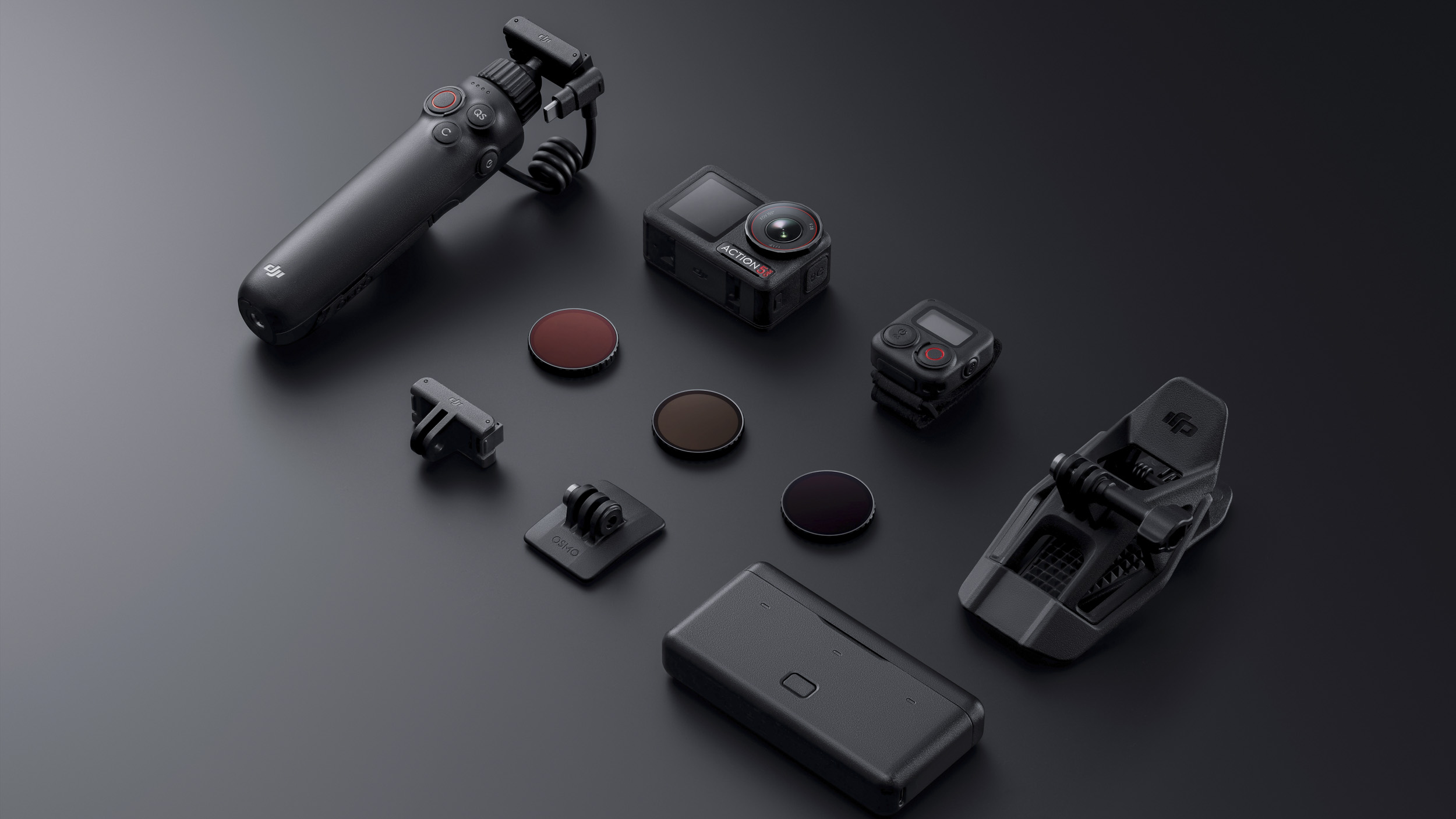 DJI Osmo Action 5 Pro camera on a gray flatlay with its accessories