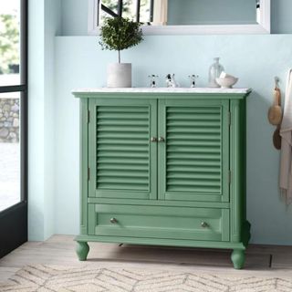 A green bathroom vanity