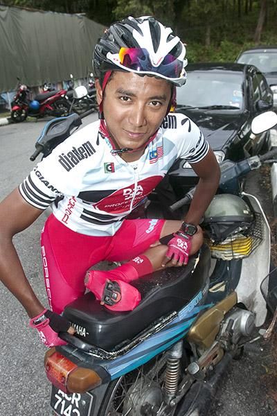 Drapac Professional Cycling's Malaysian import Adiq Othman prepares himself for the fifth stage from Tapah to the top of Genting Highlands.