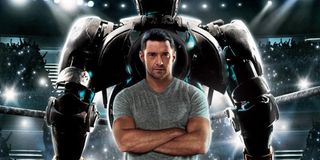 Real Steel Hugh Jackman stands in front of Atom's turned back