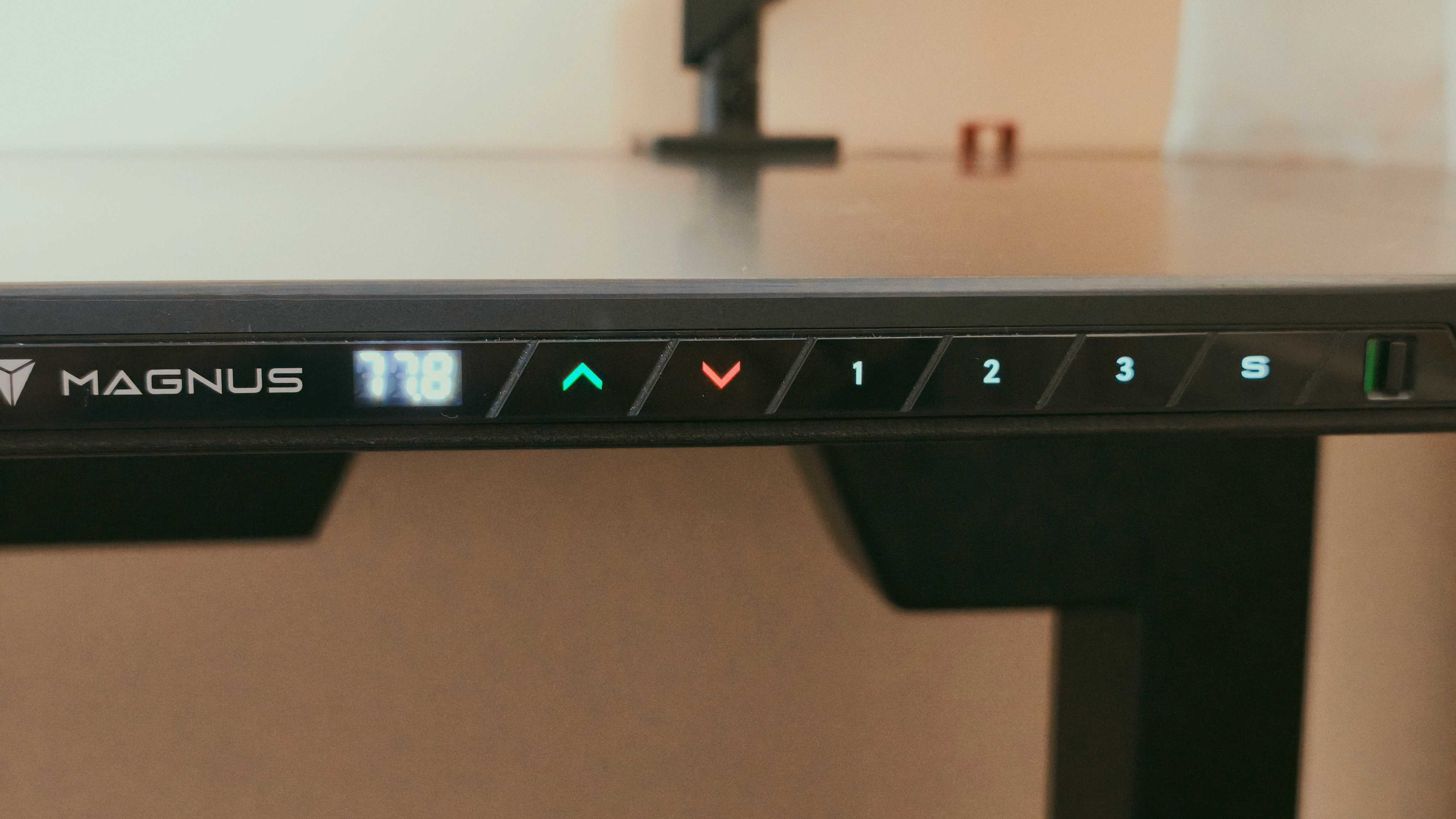 A black Secretlab Magnus Evo desk