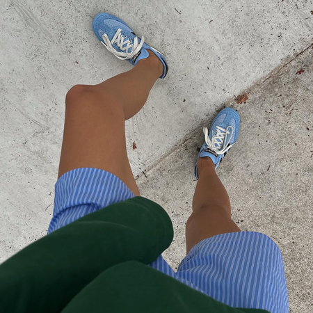 woman wearing boxer shorts with sneakers