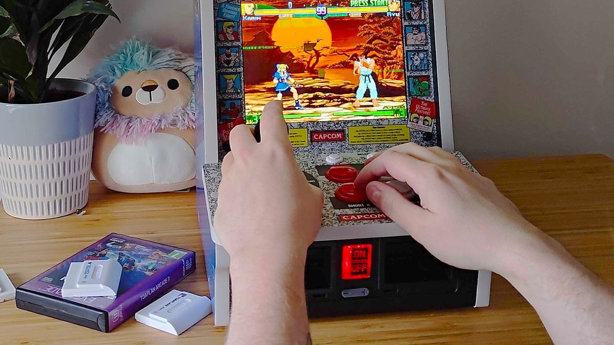 Hands playing Street Fighter Alpha 3 on Evercade Alpha arcade machine