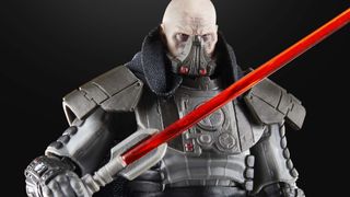 A closeup view of the face and lightsaber of The Black Series Darth Malgus