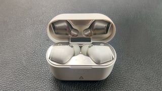 Gray Creative Zen Air SXFI earbuds in charging case