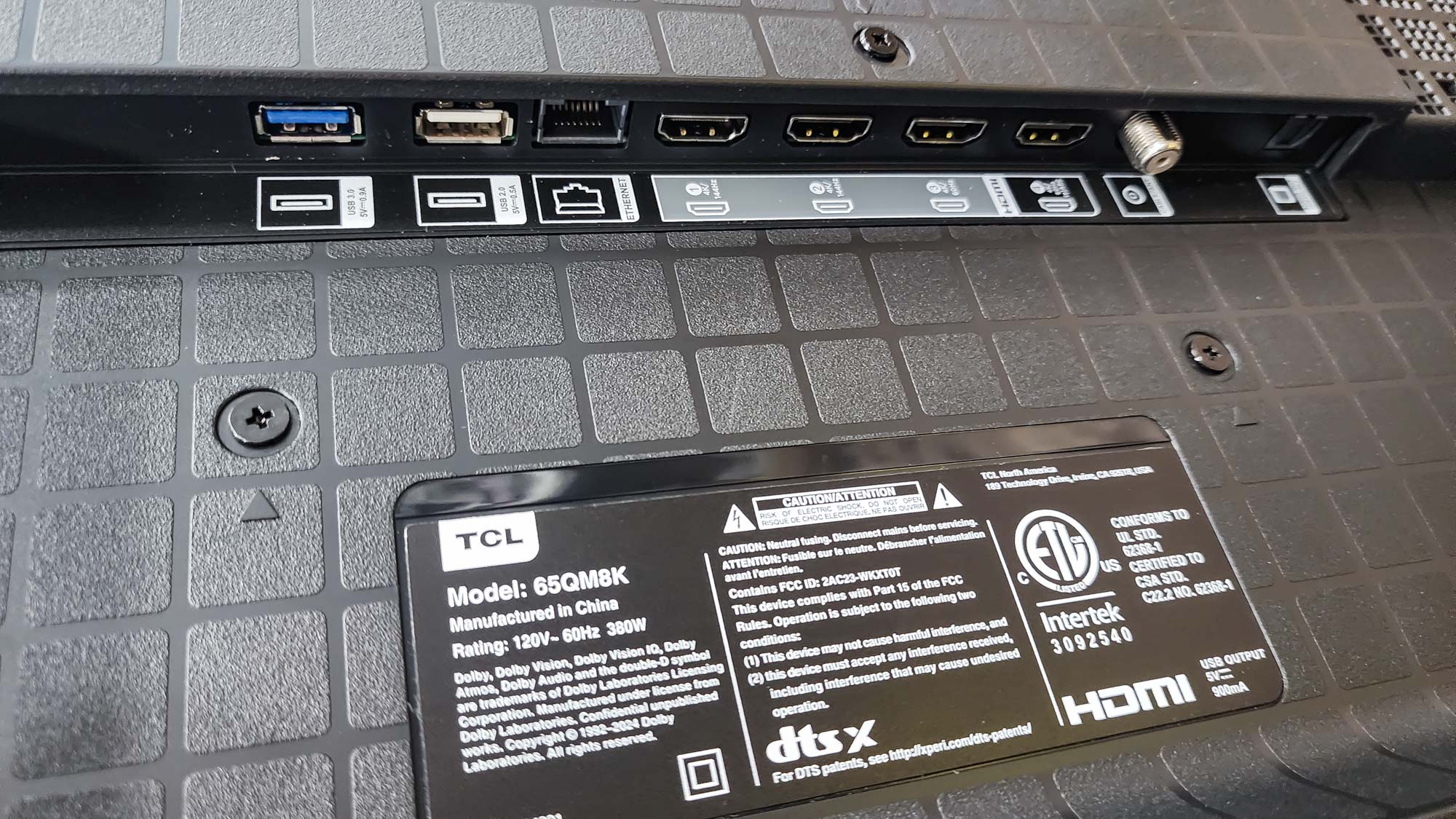 The ports on a TCL QM8K QD-Mini LED TV.