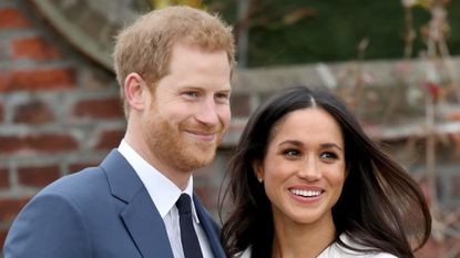 Prince Harry and actress Meghan Markle during an official photocall to announce their engagement at The Sunken Gardens at Kensington Palace on November 27, 2017 in London, England. Prince Harry and Meghan Markle have been a couple officially since November 2016 and are due to marry in Spring 2018. 