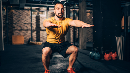 Man performing bodyweight squat