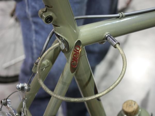 Simply pull out the cable (which is held in place with magnets and sealed in the frame with o-rings) and plug it into the receptacle on the top tube. The key cylinder is on the underside. Though not exactly terribly secure, it's undoubtedly trick.