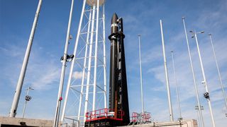 A Rocket Lab Electron rocket stands atop its pad at NASA's Wallops Flight Facility on Wallops Island, Virginia ahead of a planned launch debut from U.S. soil on Jan. 23, 2023.