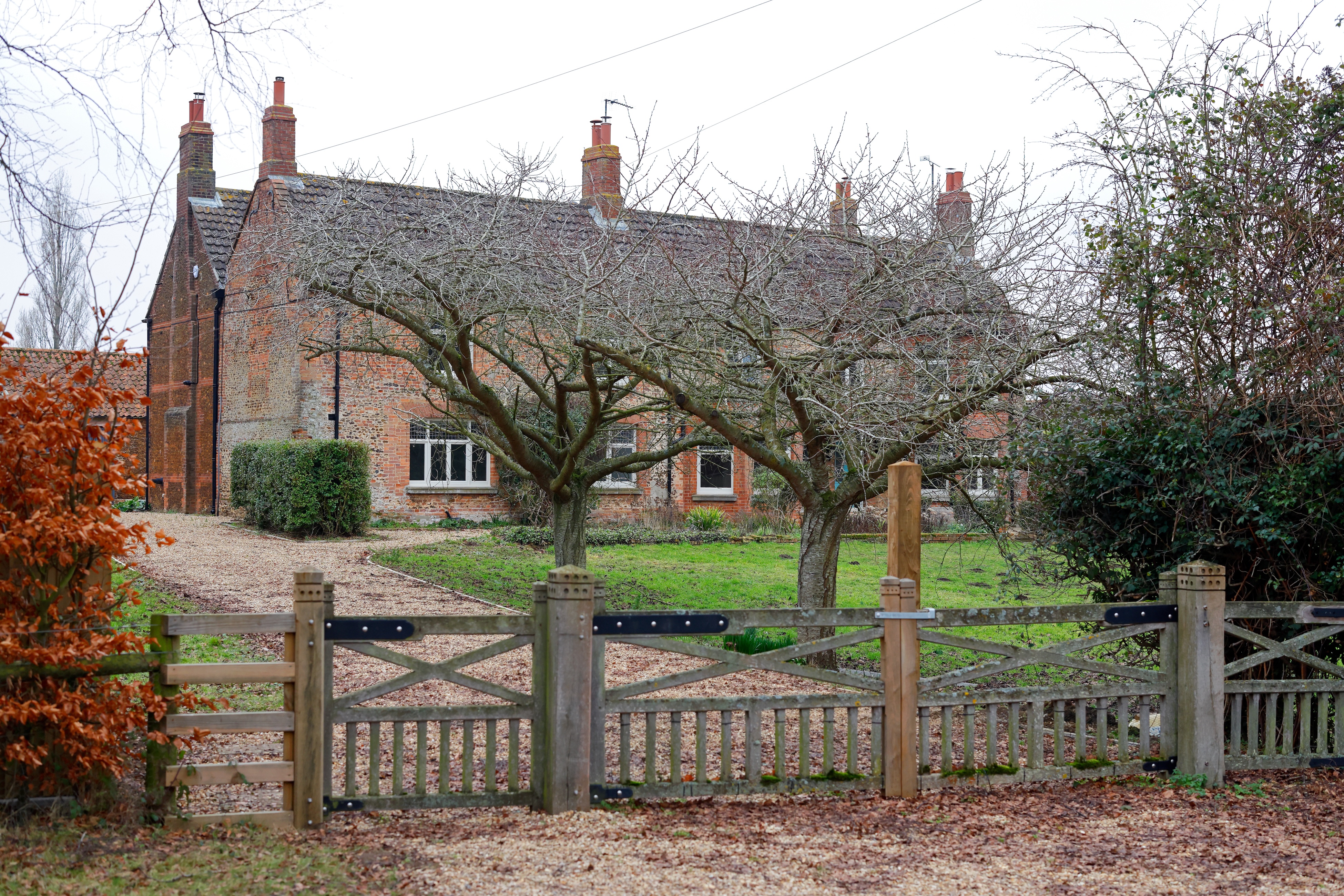 The exterior of Andrew Mountbatten-Windsor's home, Marsh Farm, surrounded by trees and a fence