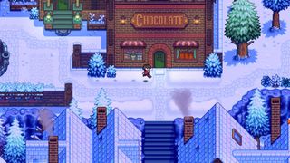 Haunted Chocolatier - A player runs in front of a shop with a sign that says "Chocolate" in a snowy village.