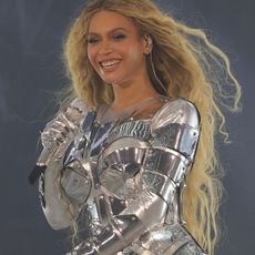 Beyonce performing in a silver bodysuit