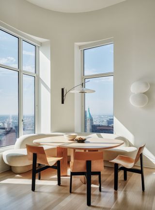 The dining space in a Manhattan apartment with sweeping views across New York City