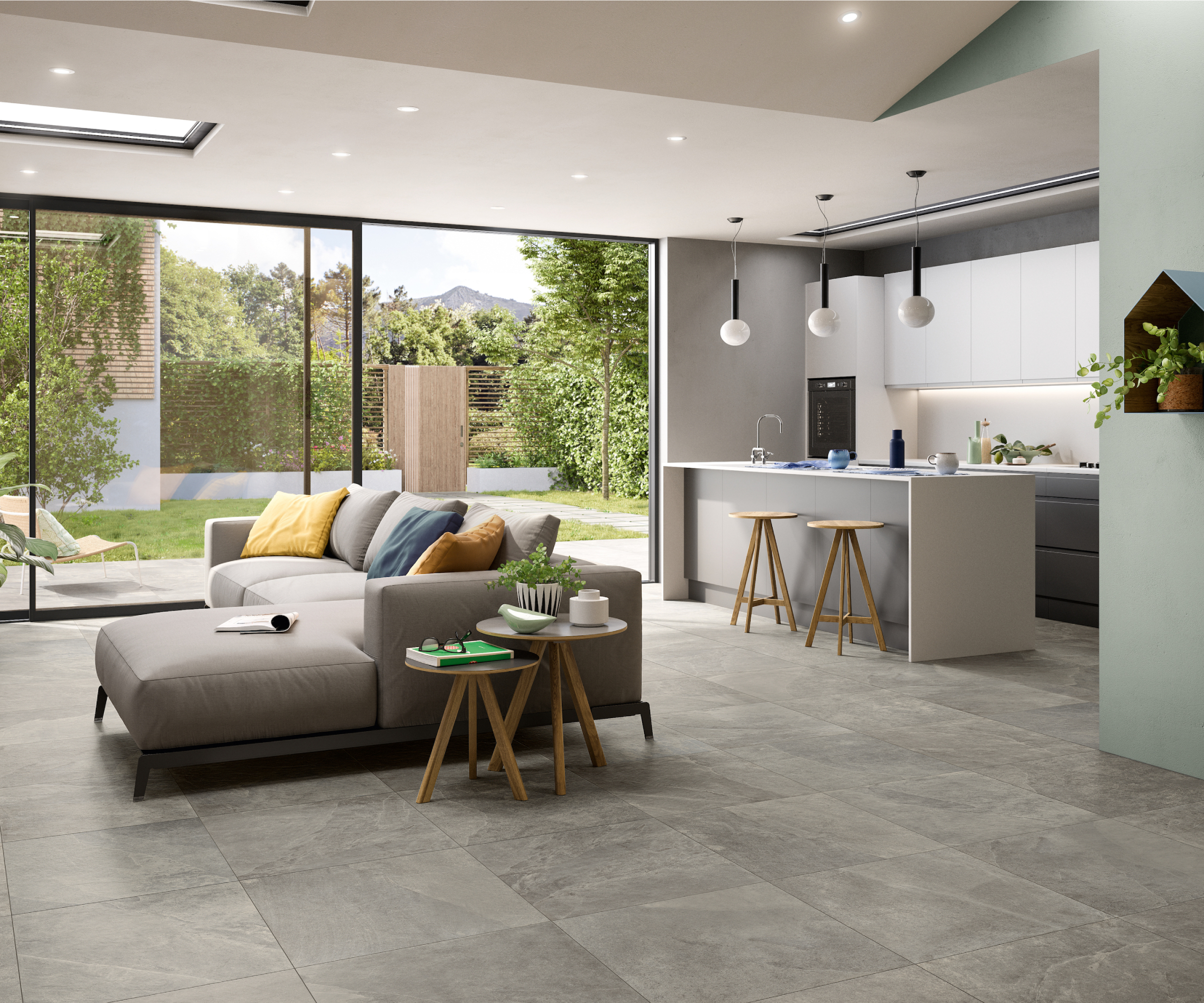 open plan living kitchen area with grey floor tiles throughout