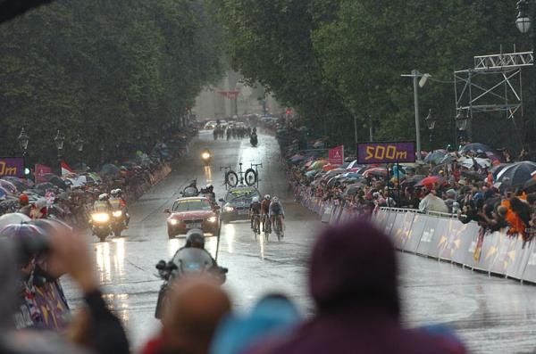 The three-woman breakaway races through the rain