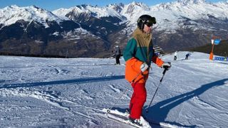 A person skiing in an Animal Arctic Mens Snow Jacket