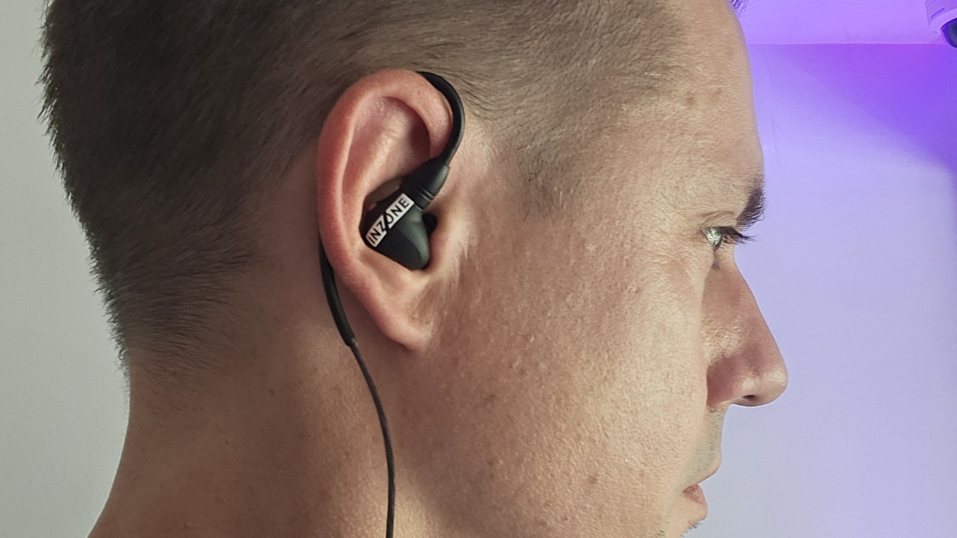 Sony Inzone E9 gaming earbuds being worn in-ear