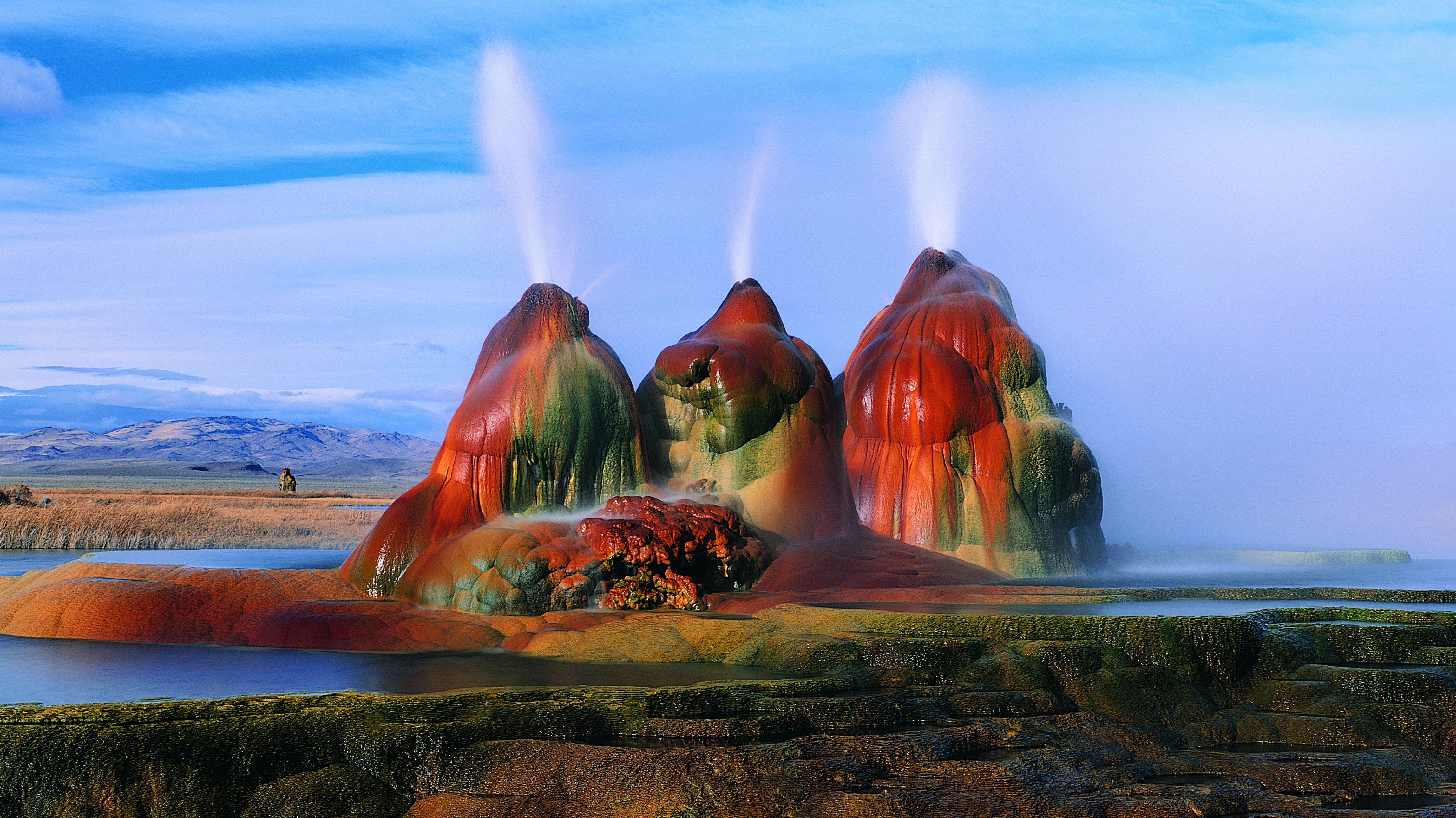 Colorful red, orange, green geyser.