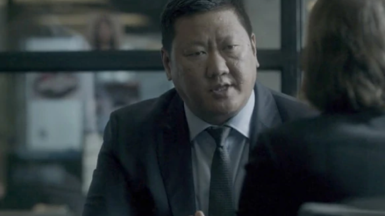 Benedict Wong in a black mirror.
