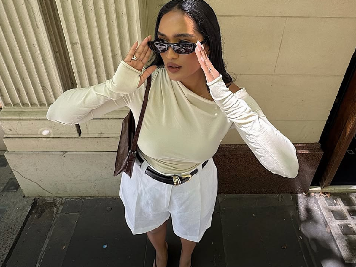 woman wearing white trouser shorts and belt