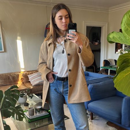 aemila madden wearing jeans, a white t-shirt, and a jacket