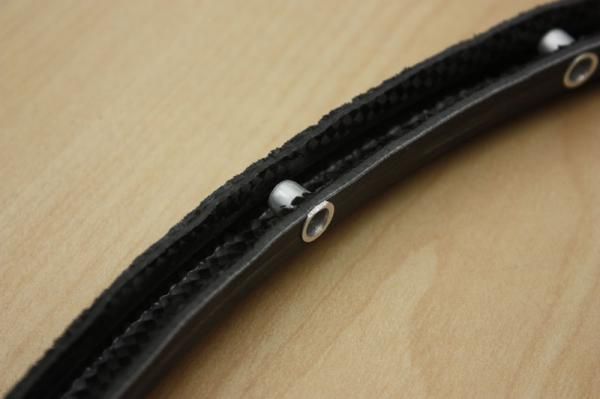 The riveted-in and threaded inserts supposedly distribute stress more evenly than traditional eyelets.