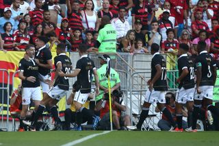 Vasco da Gama players celebrate a goal against Flamengo in June 2024.