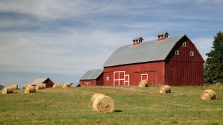 Red barn and hay bales