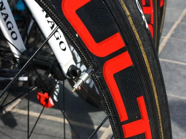 Team mechanic wrap the valve stem with a bit of electrical tape to keep it from rattling in the deep-section rims - Bonnet will use standard aluminum box-section rims for Paris-Roubaix, though.