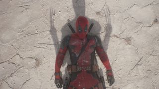 Deadpool laying on the ground with a shadow of Wolverine on top of him in Deadpool & Wolverine