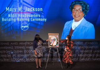 Recently, NASA named its headquarters building in honor of Mary W. Jackson, the agency's first African American female engineer. Here, Artist Tenbeete Solomon (AKA Trap Bob) (on the right) presents her artwork honoring Jackson to Wanda Jackson, Mary W. Jackson's granddaughter during the naming ceremony. Jackson, a mathematician and aerospace engineer, lead programs promoting the hiring and promotion of women in STEM [science, technology, engineering and mathematics] fields at NASA.