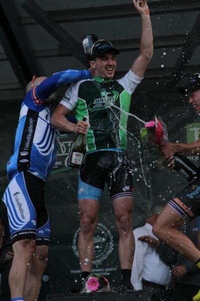 Men's winner Luke Keough gets a champagne bath on the podium.